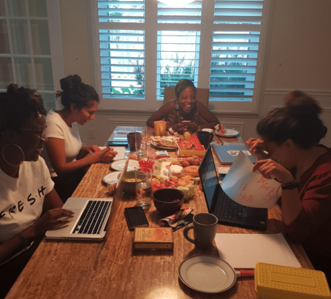 Women sitting at a table working